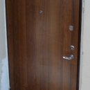 Дверь с отделкой ламинатом (св.орех)